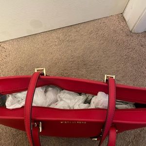 Michael Kors red tote.